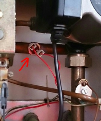 The thermistor in question is the item that the badly drawn red arrow is pointing at.