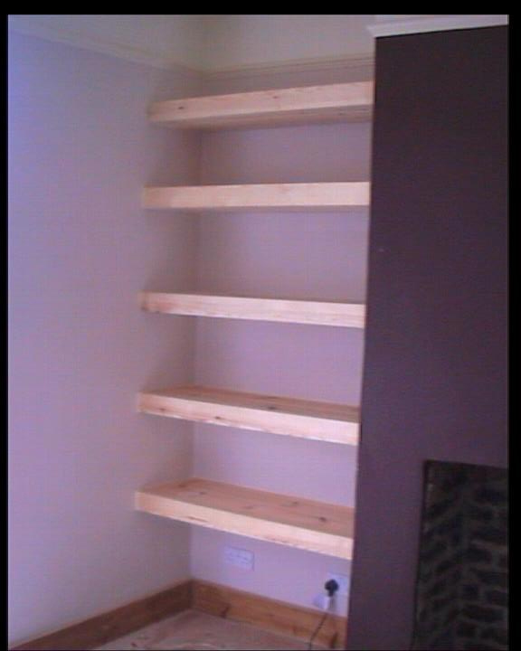 Finished shelving job with shelves added to alcove area to the side of 