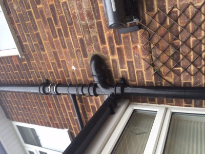 Pic shows small pipe on left bringing waste pumped from tank at side of house to main soil pipe.  The soil pipe connecting from right is from different bathroom.