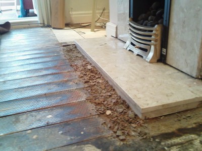 This was before it was all dug out showing the level of damp and how the concrete bed simply crumbled.