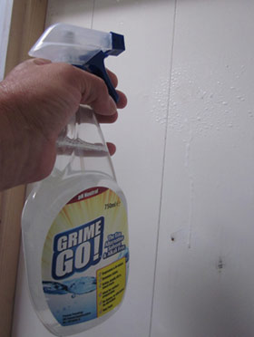 Degreasing paintwork with Grime Go to get ready for new paint on a door