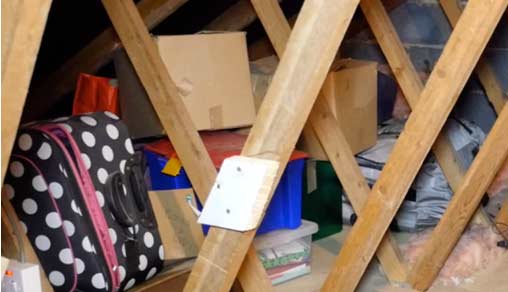 Boxes piled high in the loft before Loft Ledge