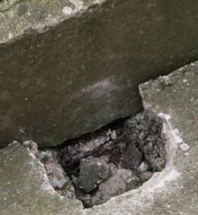 Hole in concrete path