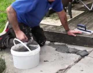 Using a pointing trowel for an epoxy mortar repair to concrete