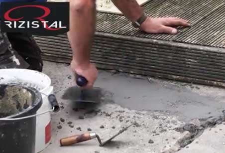 Using a plasterers finishing trowel to smooth epoxy repair mortar