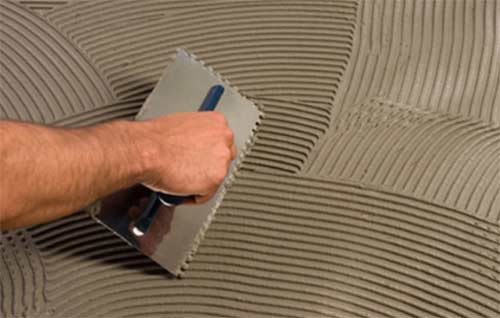 Applying tile adhesive