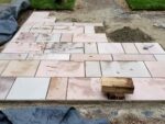 Cutting and laying paving slabs