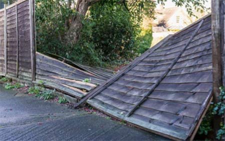 Fence blown down by wind