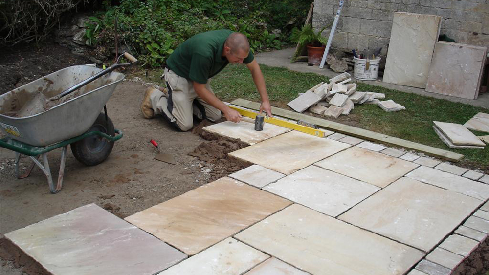 Laying Driveway Paving Slabs - Laying Gray Concrete Paving Slabs In