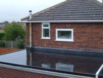 Repairing a Flat Roof with Fibre Glass Sheeting