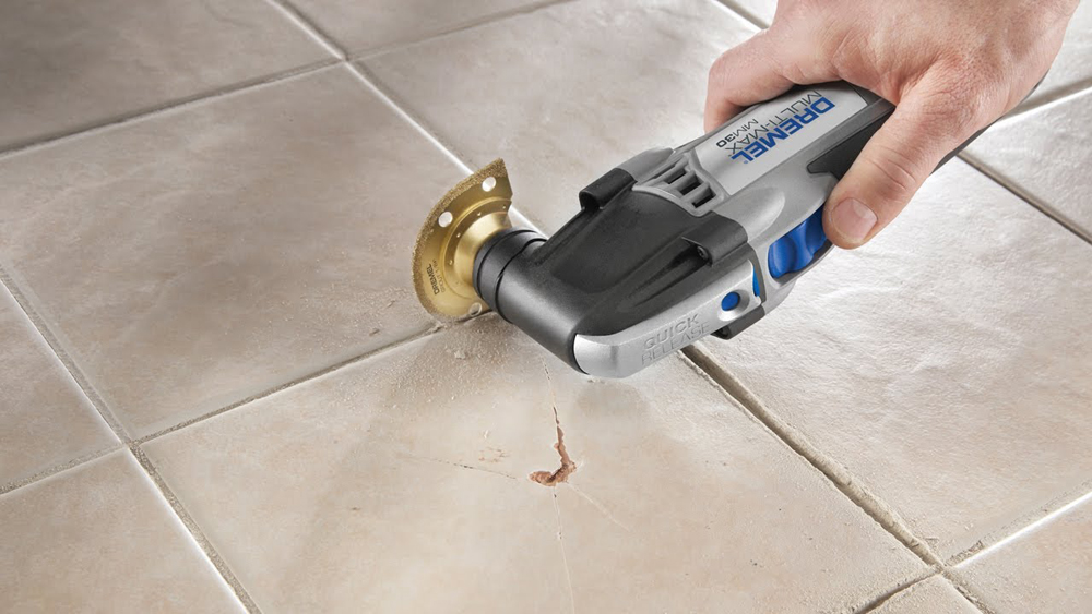 Replacing Grout Between Tiles And Raking Out Tiles For Regrouting