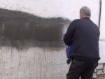 Applying a Tyrolean finish to a wall
