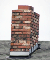Apron and stepped flashing to chimney