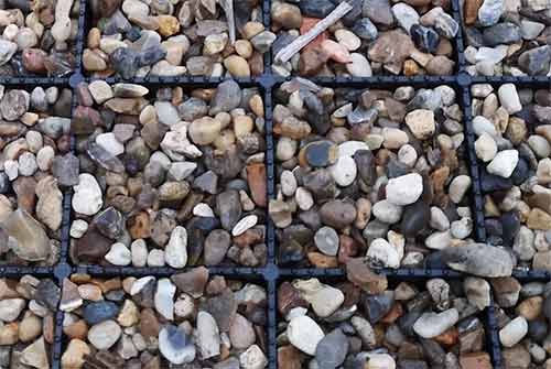 Gravel driveway laid using gravel stabilization grids