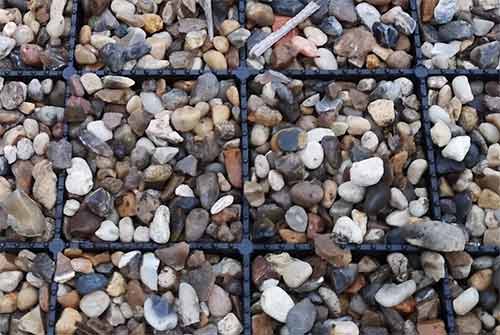 Gravel driveway laid using gravel stabilization grids