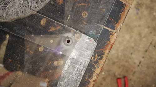 Hole drilled trough perspex for rivet