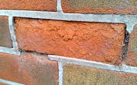 Frost damaged brick face