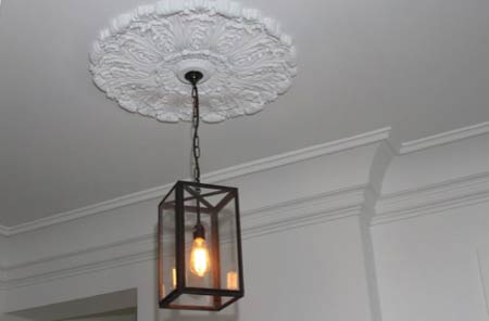 Ceiling rose around light fitting