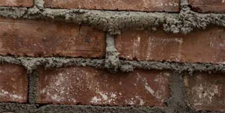 Fresh mortar in brick wall