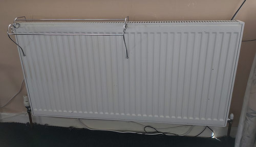 2-pipe radiator and heating system