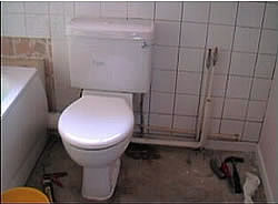 Toilet fitted and wall tiled
