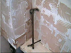 Bathroom with tiles removed