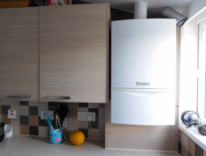 Wall mounted combi boiler in kitchen