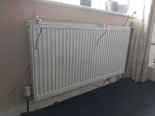 Wet central heating system using pipework and radiators to heat a home