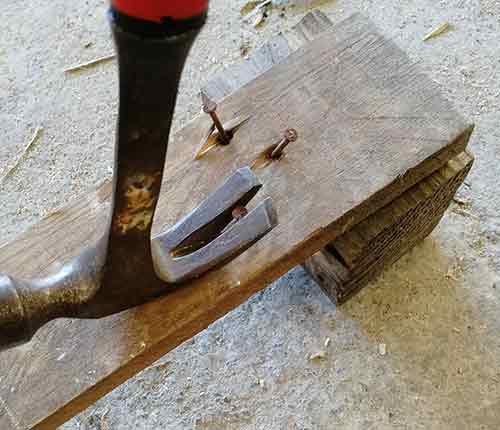 Removing nails using a claw hammer