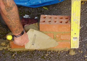 Level and plumb brickwork with a spirit level