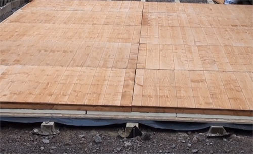 Shed base construed on timber bearing beams