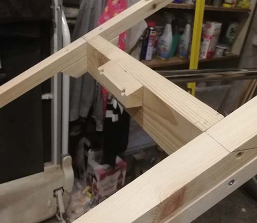 Clothes rail hanging timber mitered to fit roof slope