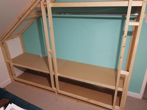 MDF fixed on to framework to form shelves