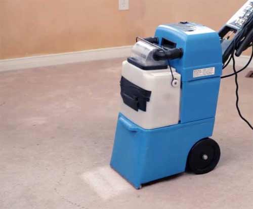 Deep cleaning a carpet with a carpet cleaner