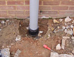 Flexible connector down on top existing cut soil pipe