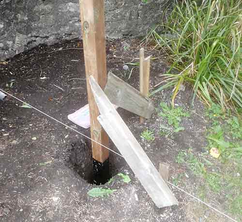 Final chicken run fence post installed