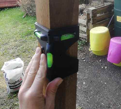 Levelling chicken run fence posts using post level