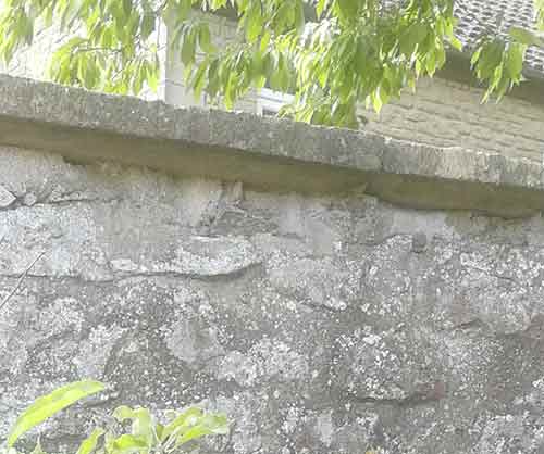 Coping stone overhang on top of wall