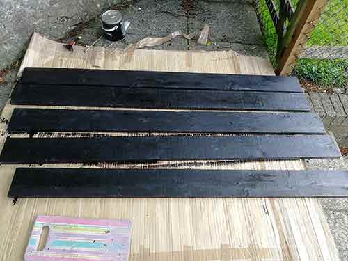 Bitumen painted gravel boards