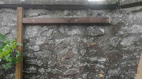 Rear horizontal timber fixed to wall