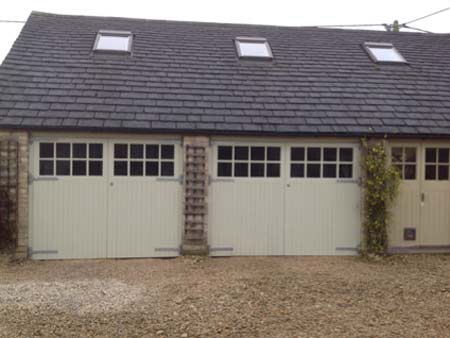 Triple garage with wooden doors