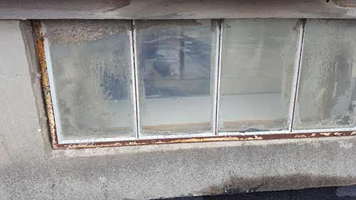 Old galavlised steel window needing putty repair