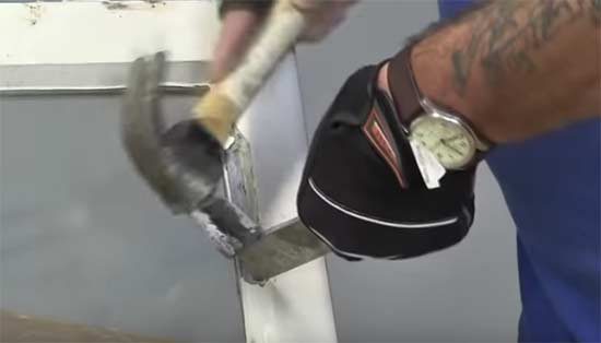 Tapping top of hacking knife to chop down through putty