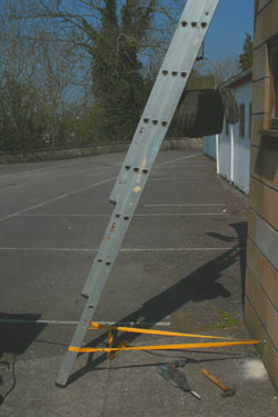 Ladder secured with ladder strap