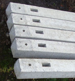 Notches in concrete fence posts for inserting rails into