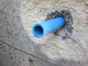 Pipes run through your cavity can transport damp to your internal wall