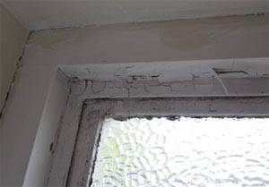 Flaking paint on window caused by condensation