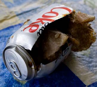 Frozen and burst Coke can