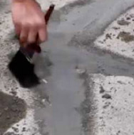 Filling shallow holes in concrete with epoxy repair mortar