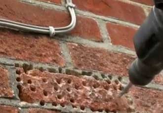 Removing a single paving brick as you would a wall brick